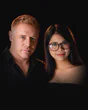 Tim and Paemi, who run Pattaya Gym, side by side in black.