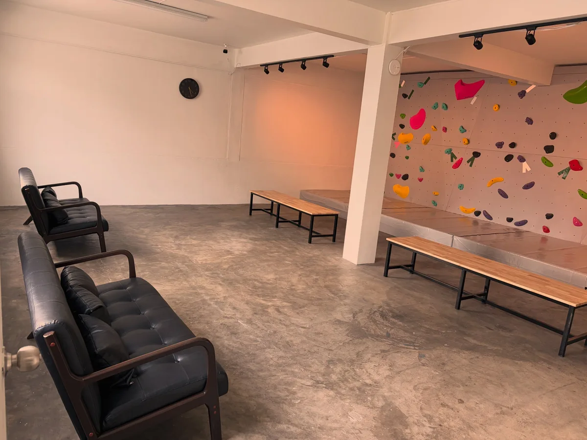 Seating beside the bouldering walls at Chill Out Climbing Gym