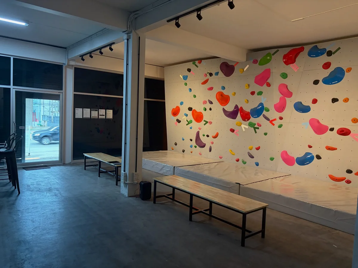 Wide view of the climbing area and benches at Chill Out Climbing Gym