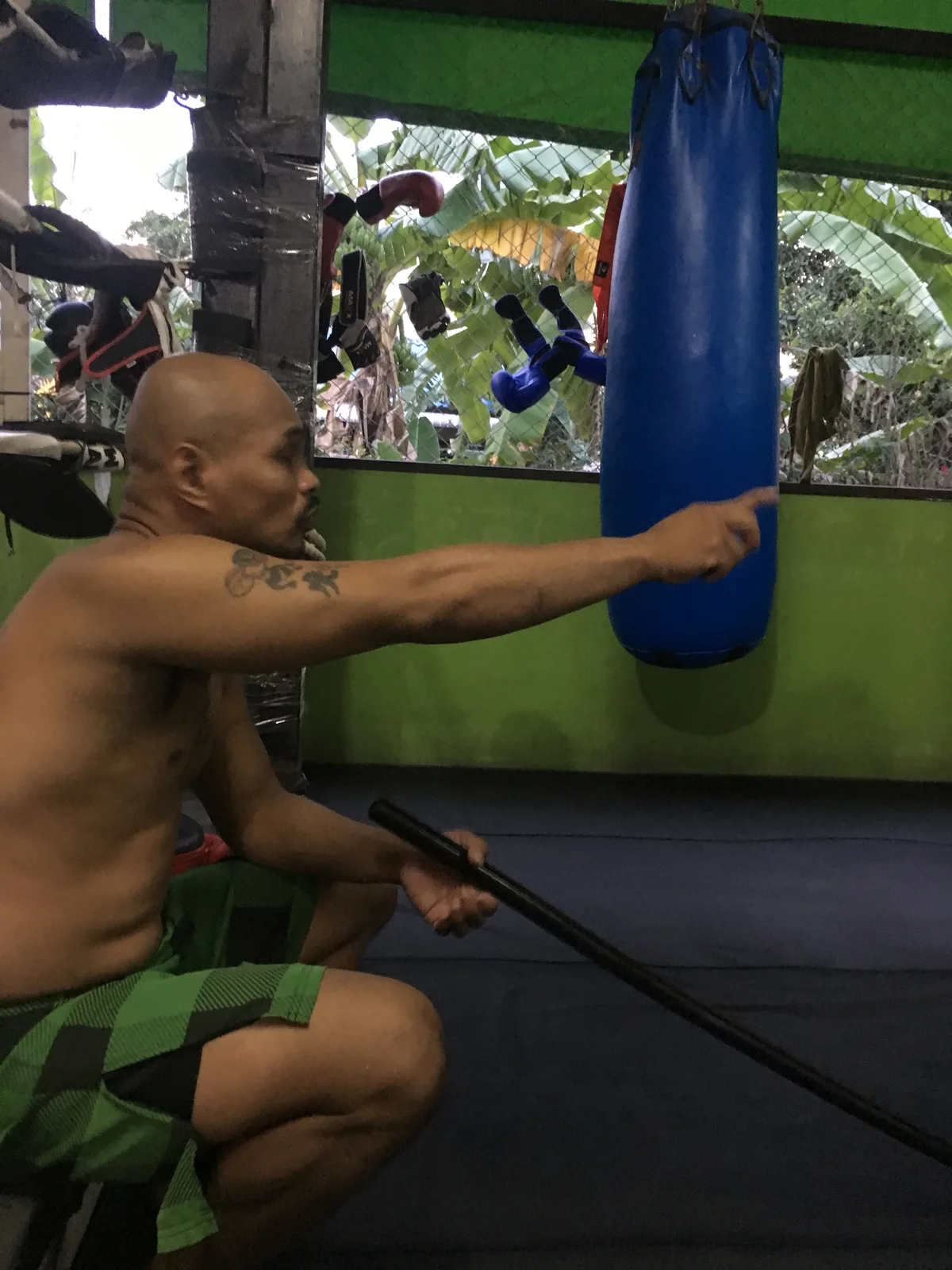Rambaa Somdet beside a heavy bag at Baan Rambaa in 2019